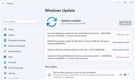 A laptop screen displaying the Windows 11 update installation progress.