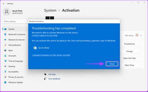 A frustrated user sitting at a desk with a laptop trying to activate Windows 11.