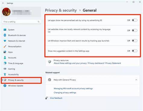 A user sitting at a desk looking at a laptop screen showing Windows 11 privacy settings.