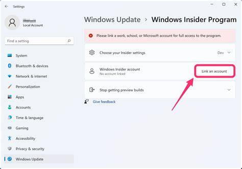 A person sitting at a desk signing up for the Windows 11 Insider Program on a laptop.