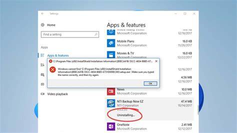 A user navigating the settings to uninstall applications on a Windows 11 laptop.