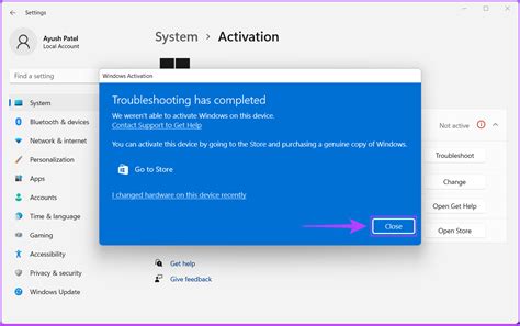 A person using a Windows 11 computer to troubleshoot activation problems.